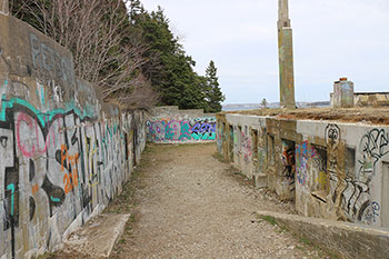 Exterior photo of the graffiti-covered World War II buildings at the York Redoubt National Historic Site in Halifax, Nova Scotia