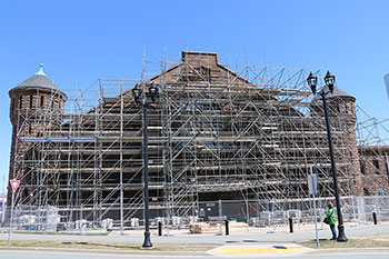 Exterior photo of the Halifax Armoury in Halifax, Nova Scotia, showing scaffolding for conservation work in progress